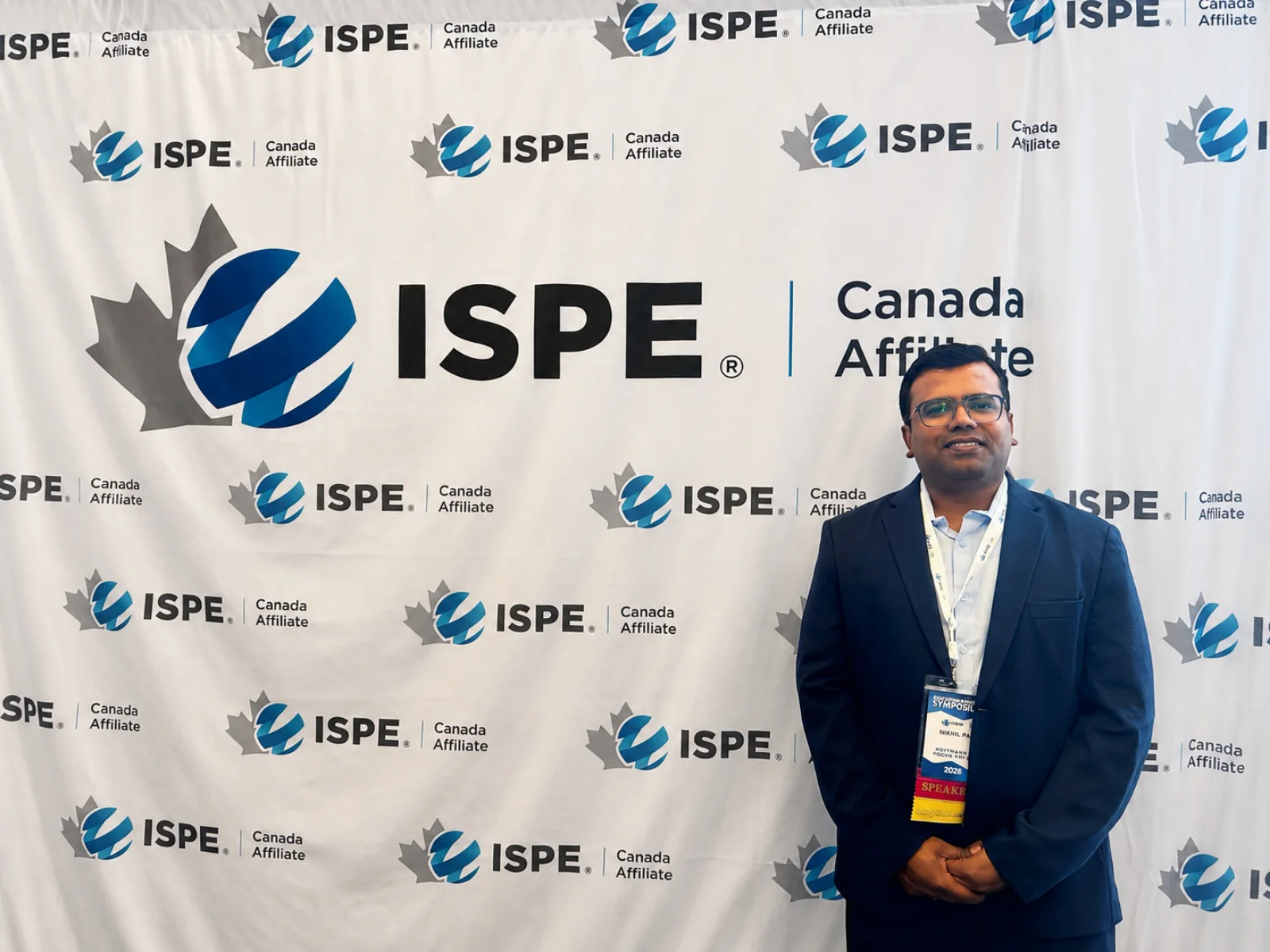 Nikhil Pal in front of the ISPE Canada Affiliate backdrop